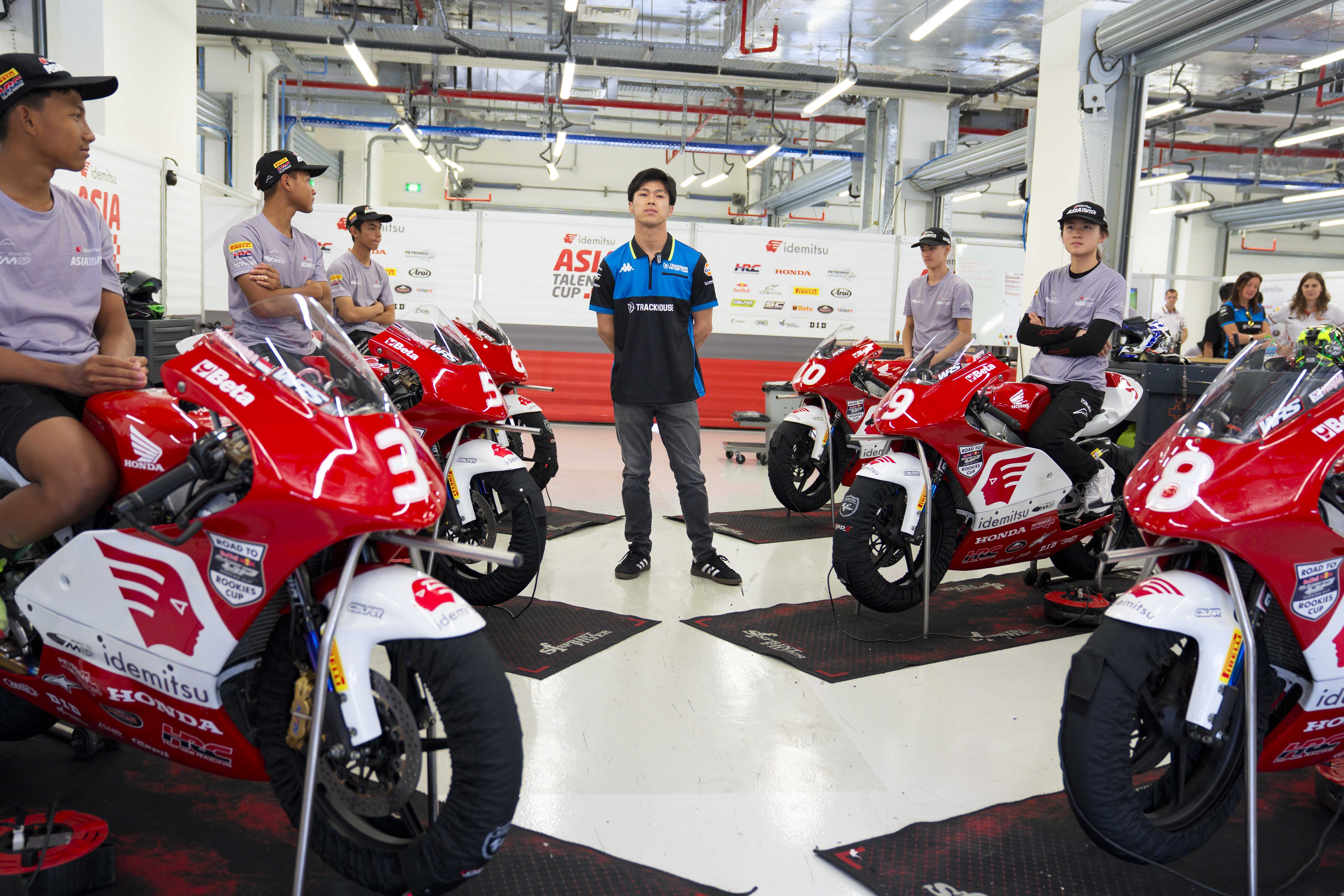 MotoGP  rider Ai Ogura with ATC riders on boxes